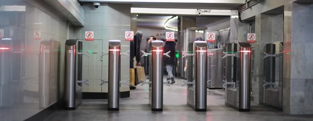 Flap barrier access control system installed at a metro station entrance for secure and automated pedestrian access management